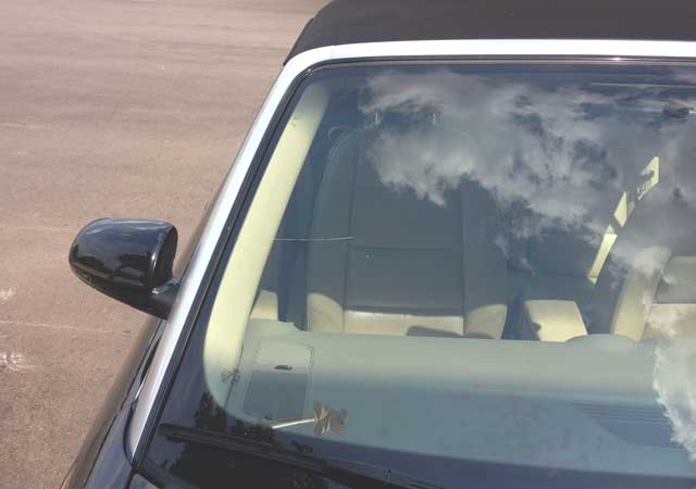 Car with a crack in its windshield in need of repair